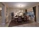 Elegant dining room with chandelier and large windows at 6217 E Sienna Bouquet Pl, Cave Creek, AZ 85331