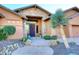 Elegant entryway with a decorative door and xeriscaped landscaping at 6217 E Sienna Bouquet Pl, Cave Creek, AZ 85331