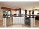 Kitchen island with granite countertops, stainless steel appliances, and a beverage fridge at 6217 E Sienna Bouquet Pl, Cave Creek, AZ 85331