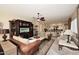 Comfortable living room with leather sofas, a large TV, and built-in shelving at 6217 E Sienna Bouquet Pl, Cave Creek, AZ 85331