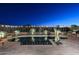 Stunning nighttime view of a kidney shaped pool with beautiful landscaping at 6217 E Sienna Bouquet Pl, Cave Creek, AZ 85331