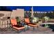 Relaxing backyard oasis with a sparkling pool, lounge chairs, and string lights at 6217 E Sienna Bouquet Pl, Cave Creek, AZ 85331