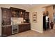 Wet bar with granite countertop, cabinetry, and wine storage at 6217 E Sienna Bouquet Pl, Cave Creek, AZ 85331