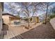 Backyard view showcasing a patio, gravel landscaping, and a shed at 755 W 2Nd St, Mesa, AZ 85201