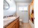 Simple bathroom with a tub shower combo and wooden vanity at 755 W 2Nd St, Mesa, AZ 85201