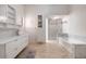 Elegant bathroom with a soaking tub and marble vanity at 755 W 2Nd St, Mesa, AZ 85201