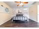 Spacious bedroom with brick accent wall and ceiling fan at 755 W 2Nd St, Mesa, AZ 85201