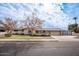 House exterior featuring a well-maintained lawn and driveway at 755 W 2Nd St, Mesa, AZ 85201