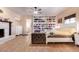 Bright main bedroom featuring a large bed and built-in shelving at 755 W 2Nd St, Mesa, AZ 85201