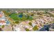 Aerial view of community, showing homes, golf course, and pond at 8062 E Cortez Dr, Scottsdale, AZ 85260