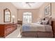 Guest bedroom with a queen bed, dresser and large window at 8062 E Cortez Dr, Scottsdale, AZ 85260