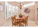 Charming breakfast nook with wood table and chairs, offering natural light at 8062 E Cortez Dr, Scottsdale, AZ 85260