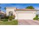 Tan stucco house with a tile roof, two-car garage, and nicely landscaped front yard at 8062 E Cortez Dr, Scottsdale, AZ 85260