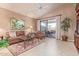 Bright living room with patio access, leather furniture, and a large picture window at 8062 E Cortez Dr, Scottsdale, AZ 85260