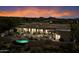 Backyard aerial view of a beautiful home with pool and fire pit at 9784 E Miramonte Dr, Scottsdale, AZ 85262