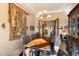 Bright dining room with a wooden table and chairs, and a view to the kitchen at 9784 E Miramonte Dr, Scottsdale, AZ 85262