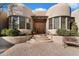 Inviting entryway with double doors and a brick walkway leading to the entrance at 9784 E Miramonte Dr, Scottsdale, AZ 85262