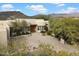 Elegant home exterior with a courtyard entry and mountain views at 9784 E Miramonte Dr, Scottsdale, AZ 85262