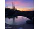 Beautiful backyard with infinity pool overlooking the desert at dusk at 9784 E Miramonte Dr, Scottsdale, AZ 85262