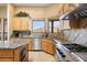 Spacious kitchen with granite countertops and stainless steel appliances at 9784 E Miramonte Dr, Scottsdale, AZ 85262