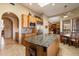 Spacious kitchen with an island, breakfast nook, and stainless steel appliances at 9784 E Miramonte Dr, Scottsdale, AZ 85262