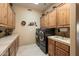 Laundry room with washer, dryer, and ample cabinetry at 9784 E Miramonte Dr, Scottsdale, AZ 85262