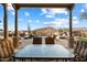 Covered patio overlooking a pool and mountain views at 9784 E Miramonte Dr, Scottsdale, AZ 85262