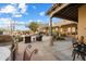 Outdoor patio with seating area and a built-in grill at 9784 E Miramonte Dr, Scottsdale, AZ 85262