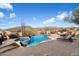 Inviting pool area with a spa, lounge chairs, and fire pit at 9784 E Miramonte Dr, Scottsdale, AZ 85262