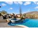 Luxury backyard oasis featuring a large pool, spa, and mountain views at 9784 E Miramonte Dr, Scottsdale, AZ 85262