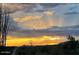 A scenic view of a sunset over mountains at 9784 E Miramonte Dr, Scottsdale, AZ 85262