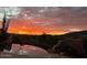Scenic view of desert landscape at sunset from beautiful pool with stone border at 9784 E Miramonte Dr, Scottsdale, AZ 85262