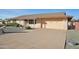 Front view of a single-story home with a two-car garage at 10633 W Cimarron Ct, Sun City, AZ 85373