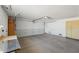 Spacious garage with an overhead door and room for storage at 10633 W Cimarron Ct, Sun City, AZ 85373