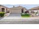 House exterior featuring a two-car garage and well-manicured lawn at 1109 W Seagull Dr, Chandler, AZ 85286