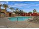 Relaxing community pool with lounge chairs and umbrellas at 1835 W Kingbird Dr, Chandler, AZ 85286