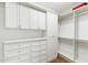 Bright, well-organized closet with ample shelving and drawer space for optimal storage at 2 E Biltmore Estates Dr # 115, Phoenix, AZ 85016