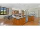 Beautiful kitchen island features stainless steel appliances, and an adjacent dining area and living room at 2 E Biltmore Estates Dr # 115, Phoenix, AZ 85016