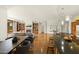 Open floor plan featuring a living room with a fireplace connected to a dining area and kitchen at 2 E Biltmore Estates Dr # 115, Phoenix, AZ 85016