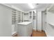 Spacious walk-in closet with custom shelving and ample storage space at 2 E Biltmore Estates Dr # 115, Phoenix, AZ 85016