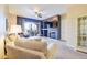 Inviting living room with fireplace, large tv, comfortable seating, and sliding doors to the outdoor patio at 3800 S Cantabria Cir # 1023, Chandler, AZ 85248