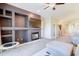 Spacious living room featuring a fireplace, large television, ample storage and nearby dining area at 3800 S Cantabria Cir # 1023, Chandler, AZ 85248