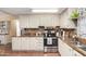 Well-equipped kitchen with stainless steel appliances and granite countertops at 5502 E Baywood Ave, Mesa, AZ 85206