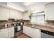 Modern kitchen, featuring stainless steel appliances and granite countertops at 5502 E Baywood Ave, Mesa, AZ 85206