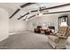 Spacious living room with wood beam ceilings and comfortable seating at 5502 E Baywood Ave, Mesa, AZ 85206