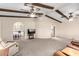 Open living room with wood beam ceilings and views into dining area and kitchen at 5502 E Baywood Ave, Mesa, AZ 85206