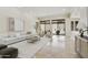 Bright, open living area with travertine floors, neutral decor, sliding doors to yard, and stylish furnishing at 8146 E Wingspan Way, Scottsdale, AZ 85255
