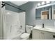 Updated bathroom with white vanity and bathtub at 1230 N 84Th Pl, Scottsdale, AZ 85257