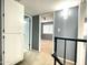 Hallway with carpet, doors to bedrooms, and access to upper level at 1230 N 84Th Pl, Scottsdale, AZ 85257