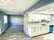 Modern kitchen with white cabinets and granite countertops at 1230 N 84Th Pl, Scottsdale, AZ 85257